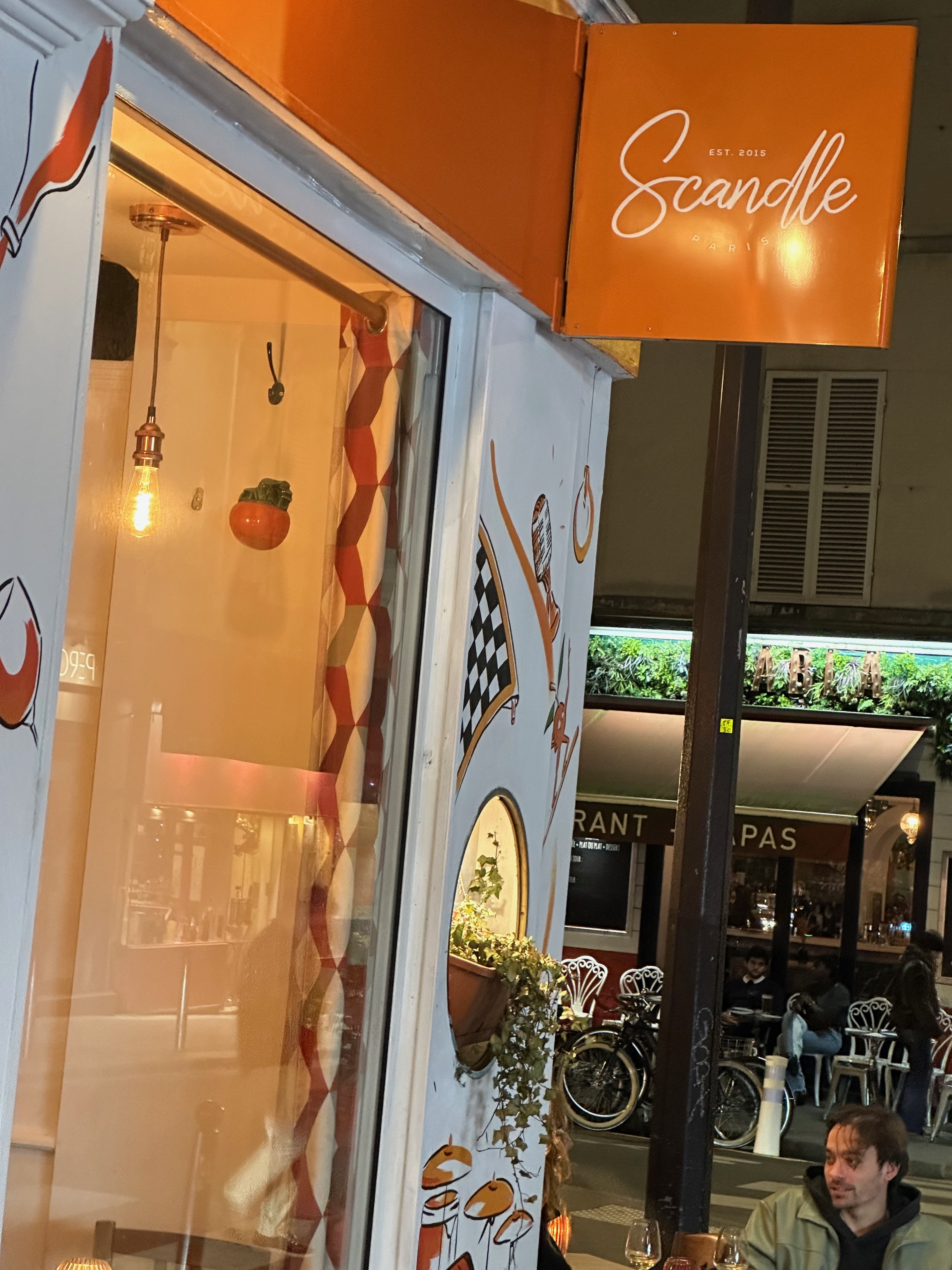 Scandle restaurant exterior at night on Rue Blanche, Paris